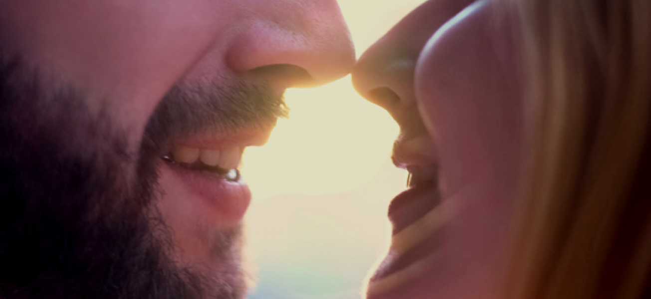 Close up of man and woman couple about to kiss