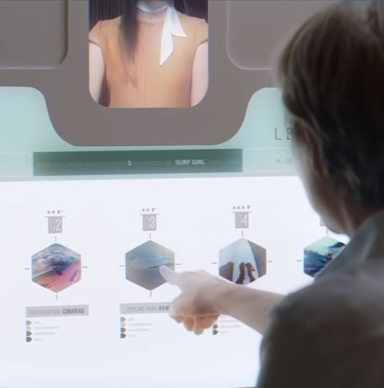Beyond Money short film screenshot: Person using large computer touch screen 