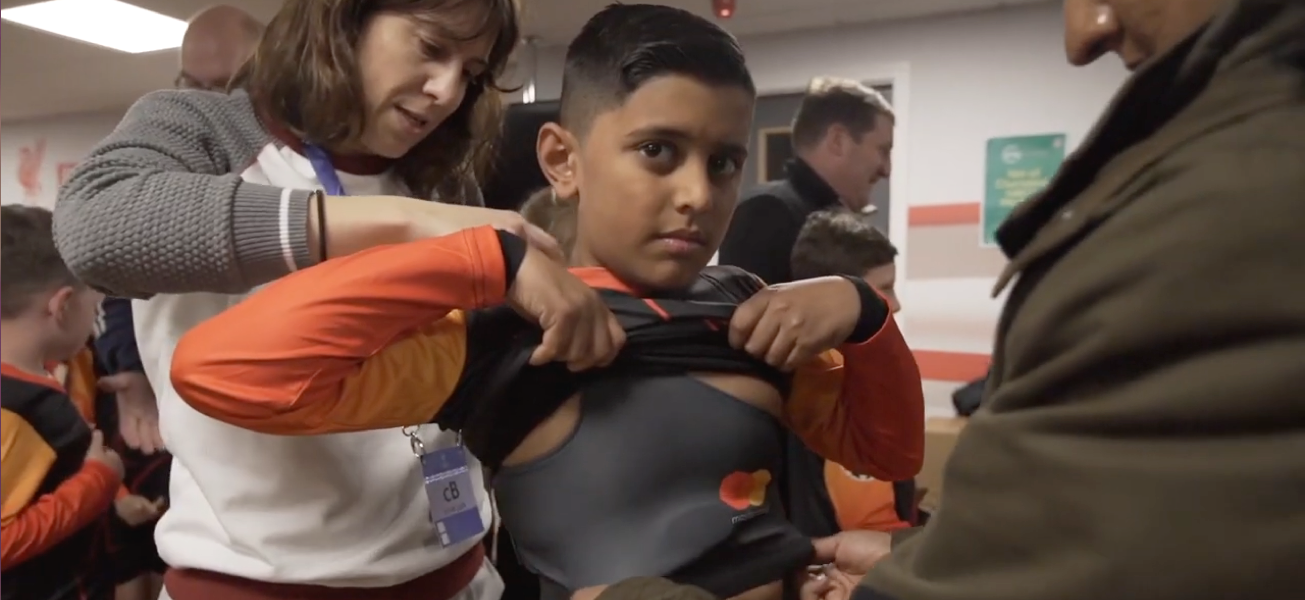 Video Screenshot: Child putting on Mastercard Kit Beats Jersey 